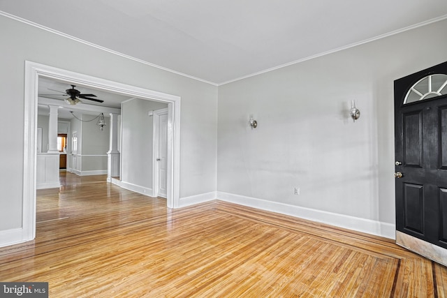 empty room featuring crown molding and hardwood / wood-style floors