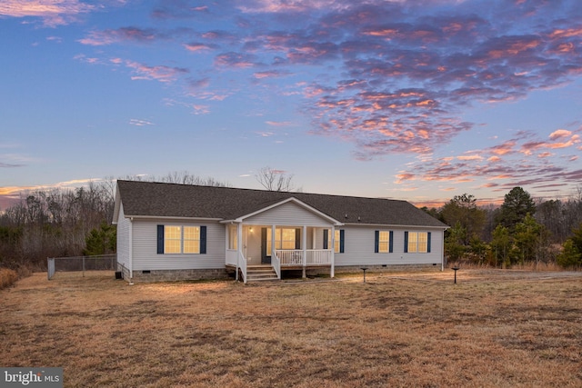 view of front of home featuring a yard and covered porch