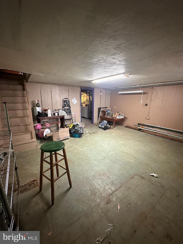 basement featuring a textured ceiling