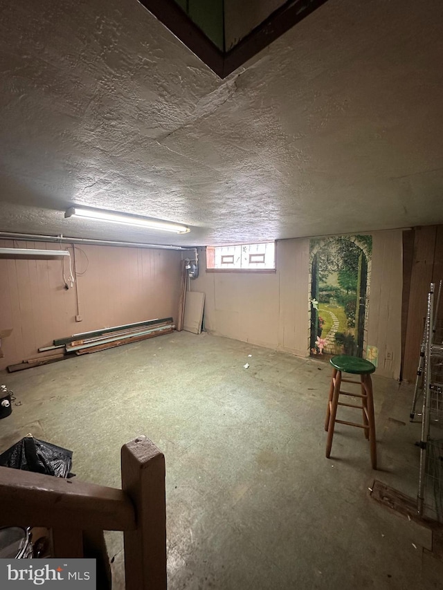 basement with a textured ceiling