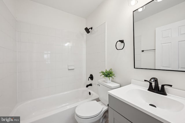 full bathroom with tub / shower combination, vanity, and toilet