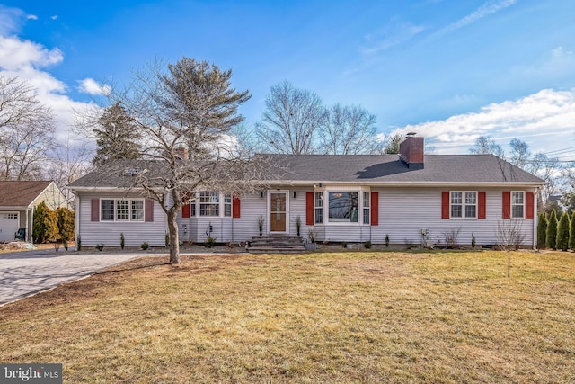 ranch-style home featuring a front yard