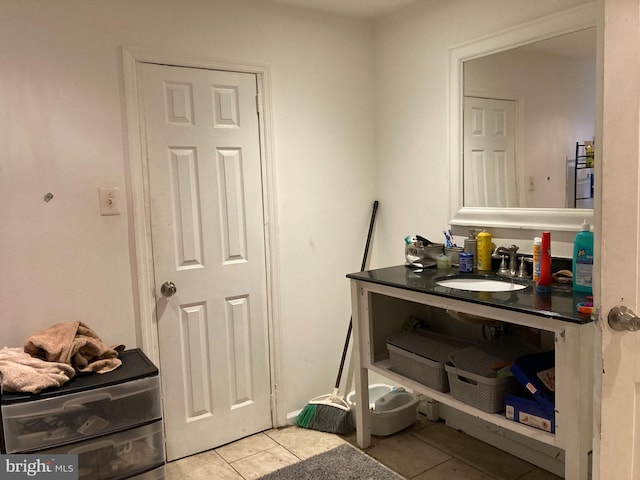 bathroom with tile patterned flooring and sink