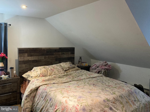 bedroom featuring lofted ceiling