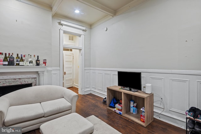 living room with crown molding, dark hardwood / wood-style flooring, coffered ceiling, and beam ceiling