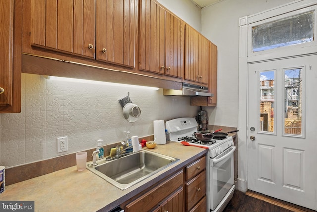 kitchen with sink and white gas stove