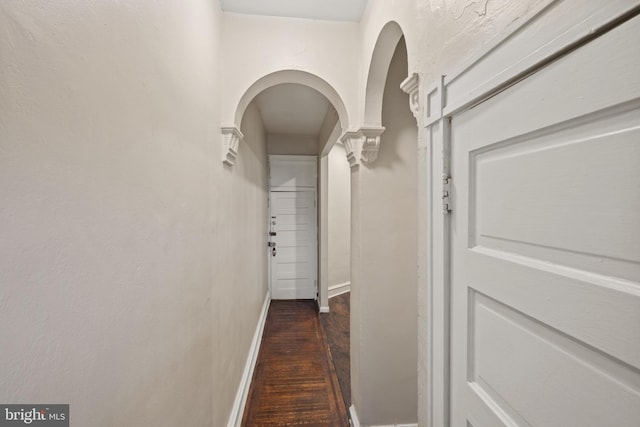 hallway with dark wood-type flooring