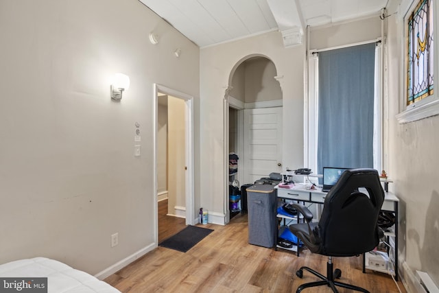 office space featuring light hardwood / wood-style flooring and baseboard heating