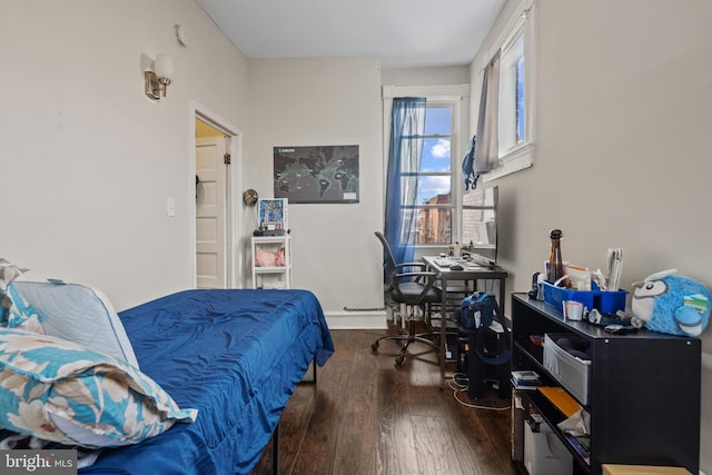 bedroom featuring dark wood-type flooring