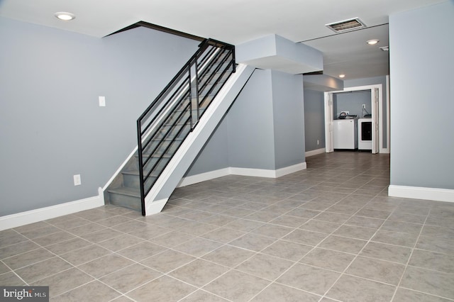 basement featuring light tile patterned floors