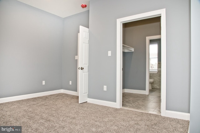 unfurnished bedroom featuring light colored carpet