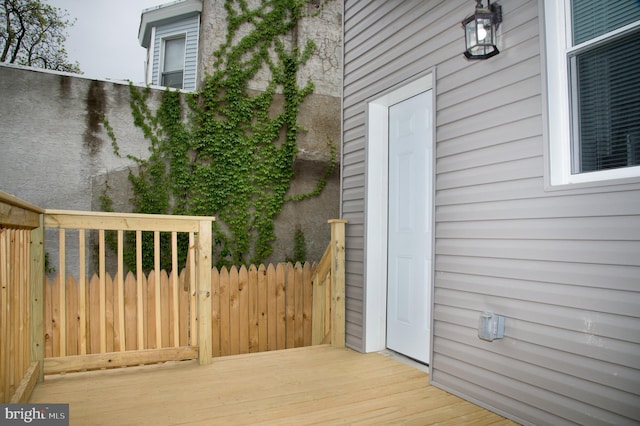 view of side of property featuring a deck