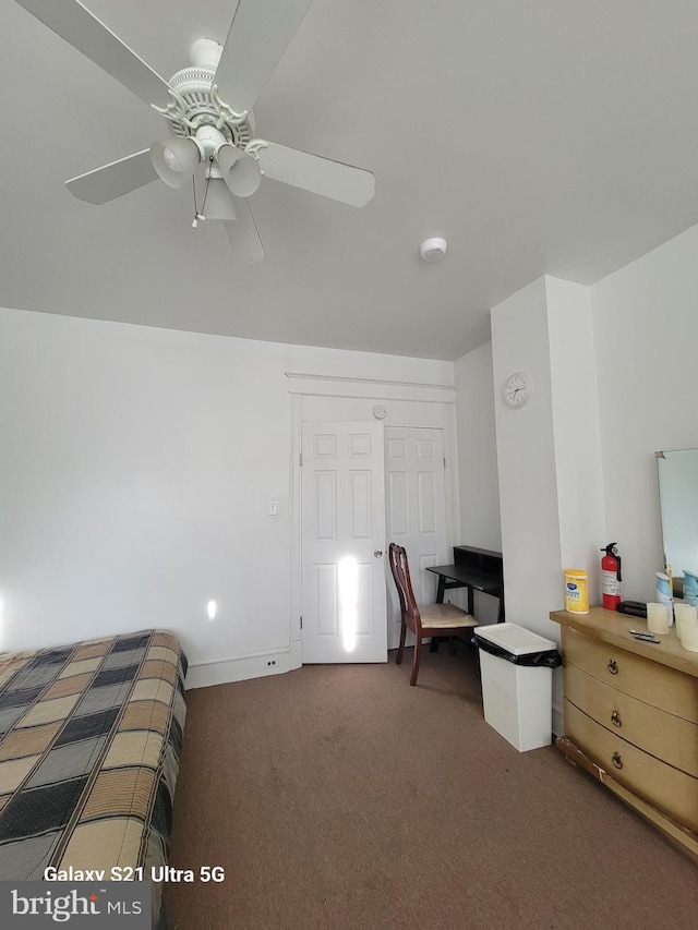 carpeted bedroom with ceiling fan