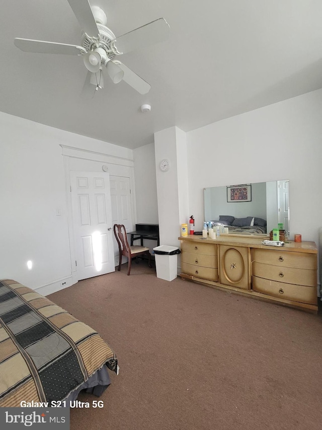 carpeted bedroom featuring ceiling fan