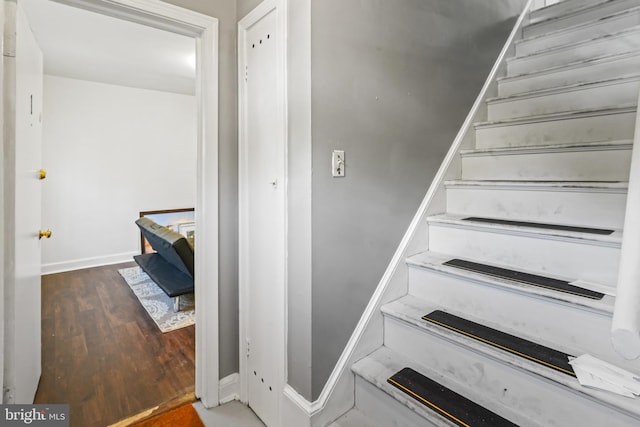 stairway featuring hardwood / wood-style floors