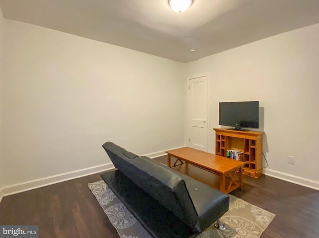 living room featuring dark hardwood / wood-style flooring