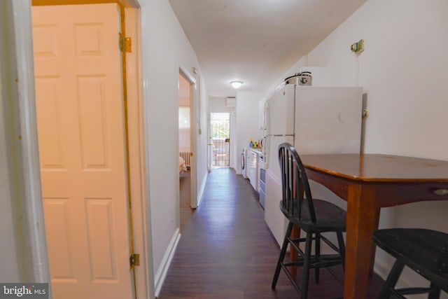 hall with radiator heating unit and dark hardwood / wood-style floors