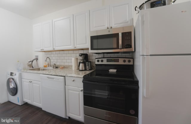 kitchen featuring washer / clothes dryer, appliances with stainless steel finishes, sink, and white cabinets