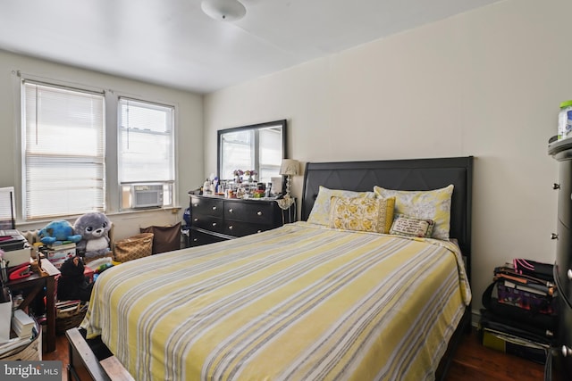 bedroom featuring cooling unit and dark hardwood / wood-style floors