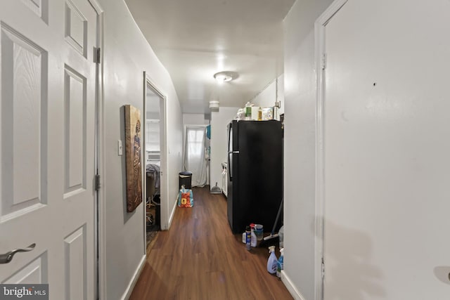 hallway with dark hardwood / wood-style flooring