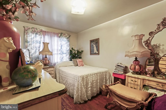 bedroom with wood-type flooring