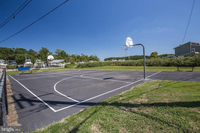 view of sport court featuring community basketball court and a yard