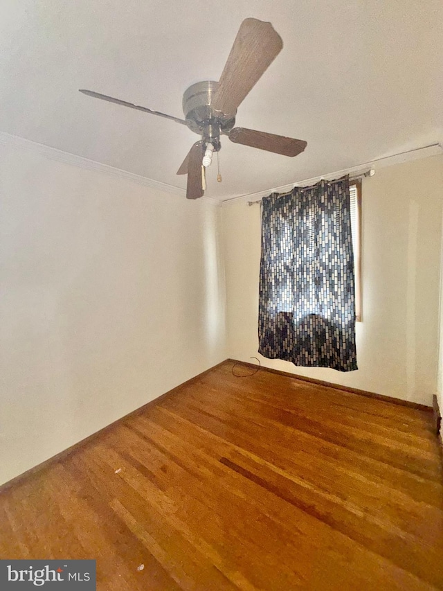 unfurnished room featuring crown molding, ceiling fan, and wood-type flooring