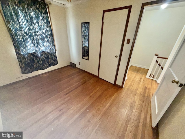 unfurnished bedroom with light wood-type flooring