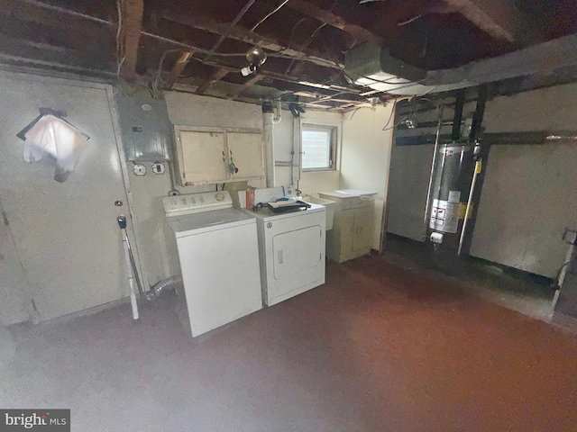 basement with washer and clothes dryer and water heater