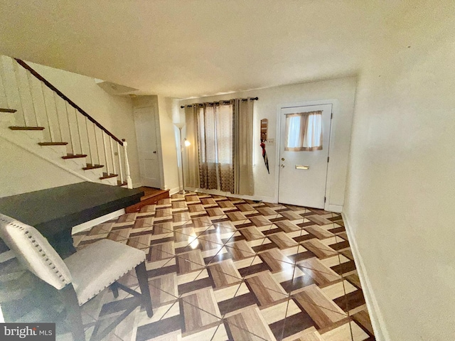 foyer with light parquet floors