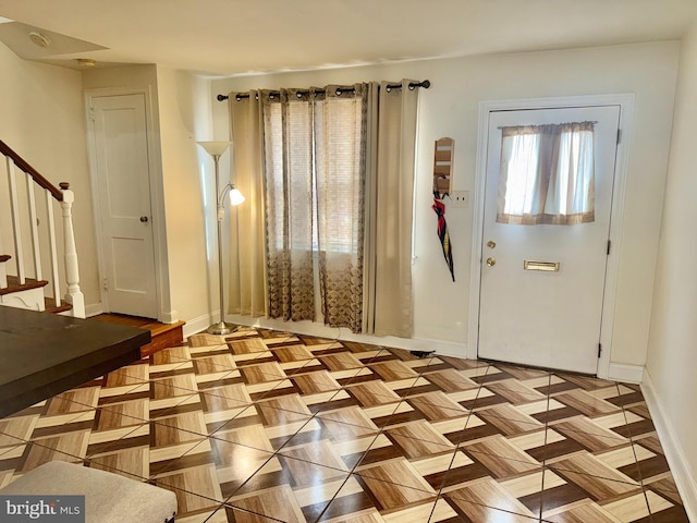 entrance foyer featuring light parquet floors