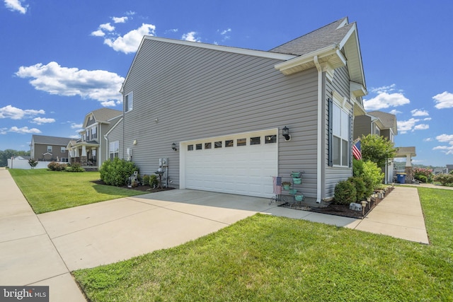 view of home's exterior featuring a yard and driveway