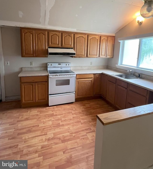 kitchen featuring lofted ceiling, sink, white electric stove, and light wood-type flooring