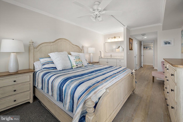 bedroom featuring ornamental molding, hardwood / wood-style floors, and ceiling fan