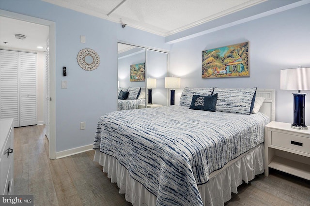 bedroom with crown molding and light wood-type flooring