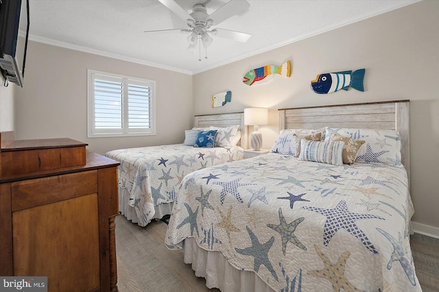 bedroom featuring ornamental molding, dark hardwood / wood-style floors, and ceiling fan