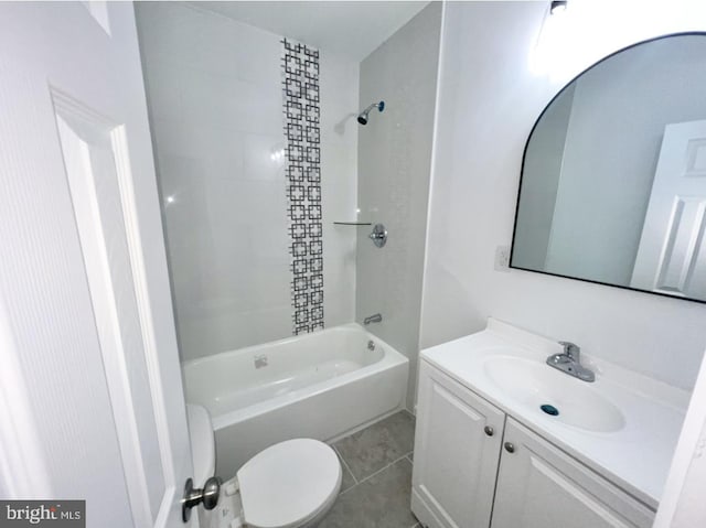 full bathroom with vanity, tiled shower / bath combo, tile patterned floors, and toilet