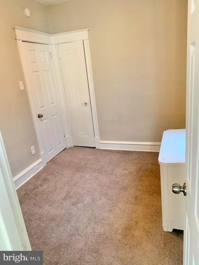 unfurnished bedroom with carpet floors