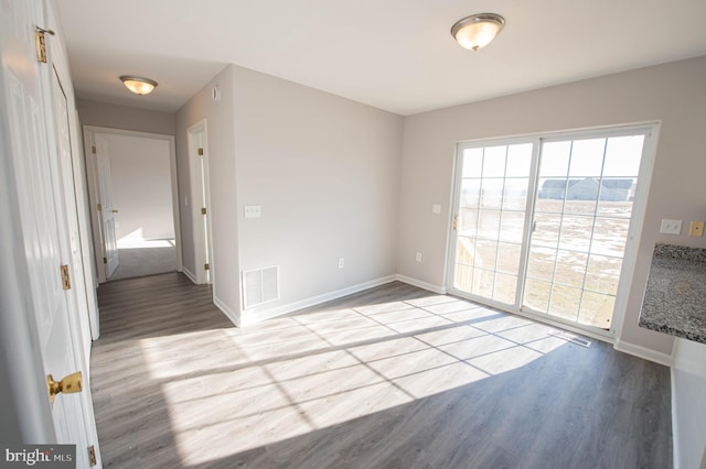 empty room with light wood-type flooring