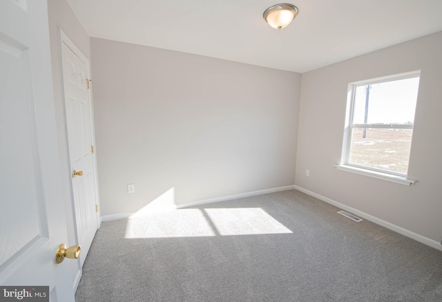 view of carpeted spare room