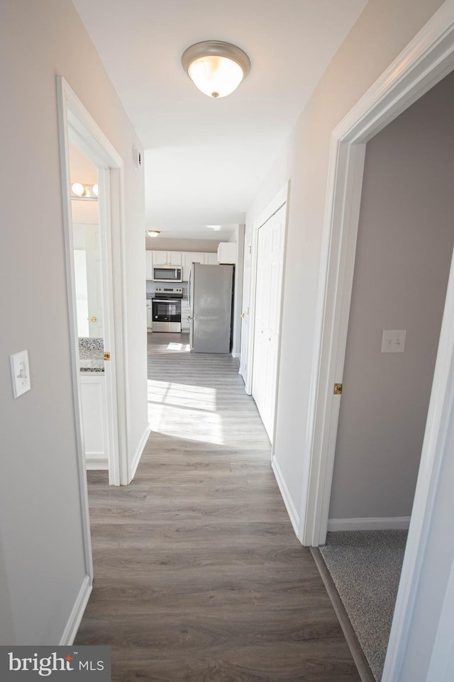 hallway featuring light hardwood / wood-style floors