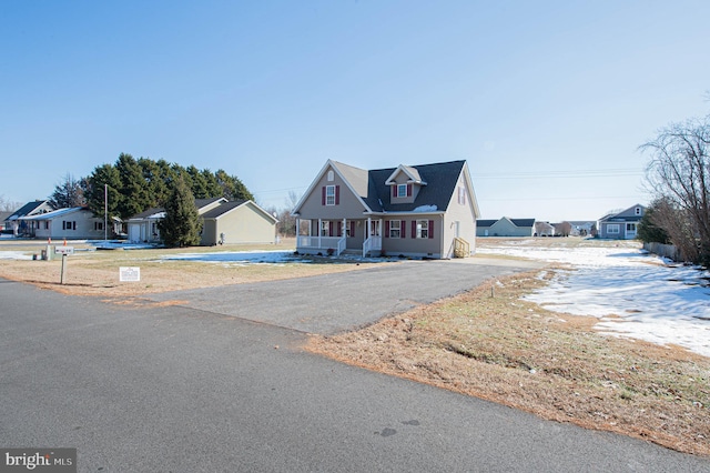 cape cod home with covered porch