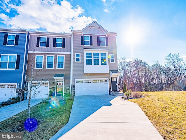 multi unit property featuring a garage and a front yard