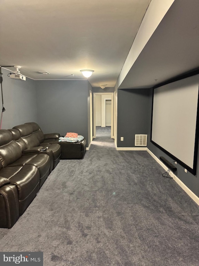 home theater with dark colored carpet