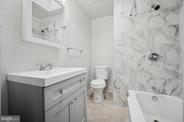 full bathroom with vanity, tiled shower / bath, and toilet