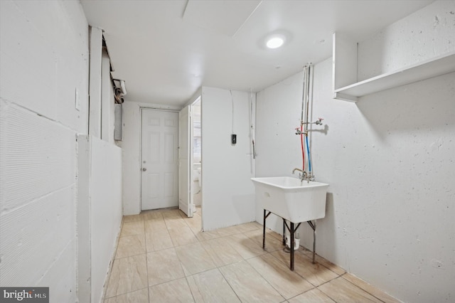 basement featuring light tile patterned floors