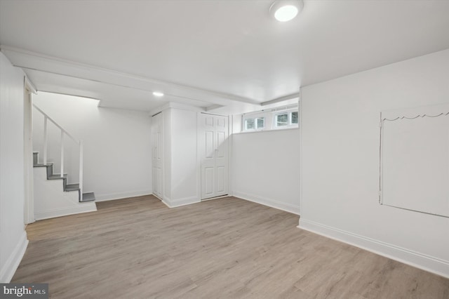 basement featuring light hardwood / wood-style floors