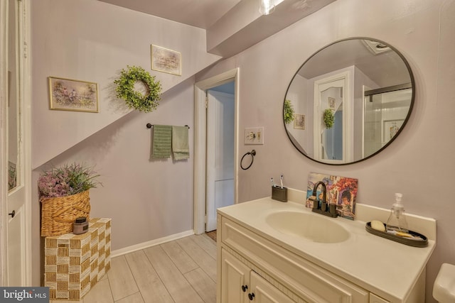 bathroom with wood-type flooring and vanity