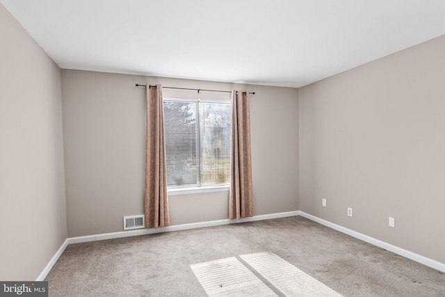 empty room featuring carpet flooring