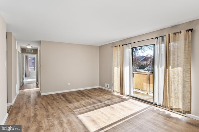 empty room featuring hardwood / wood-style floors